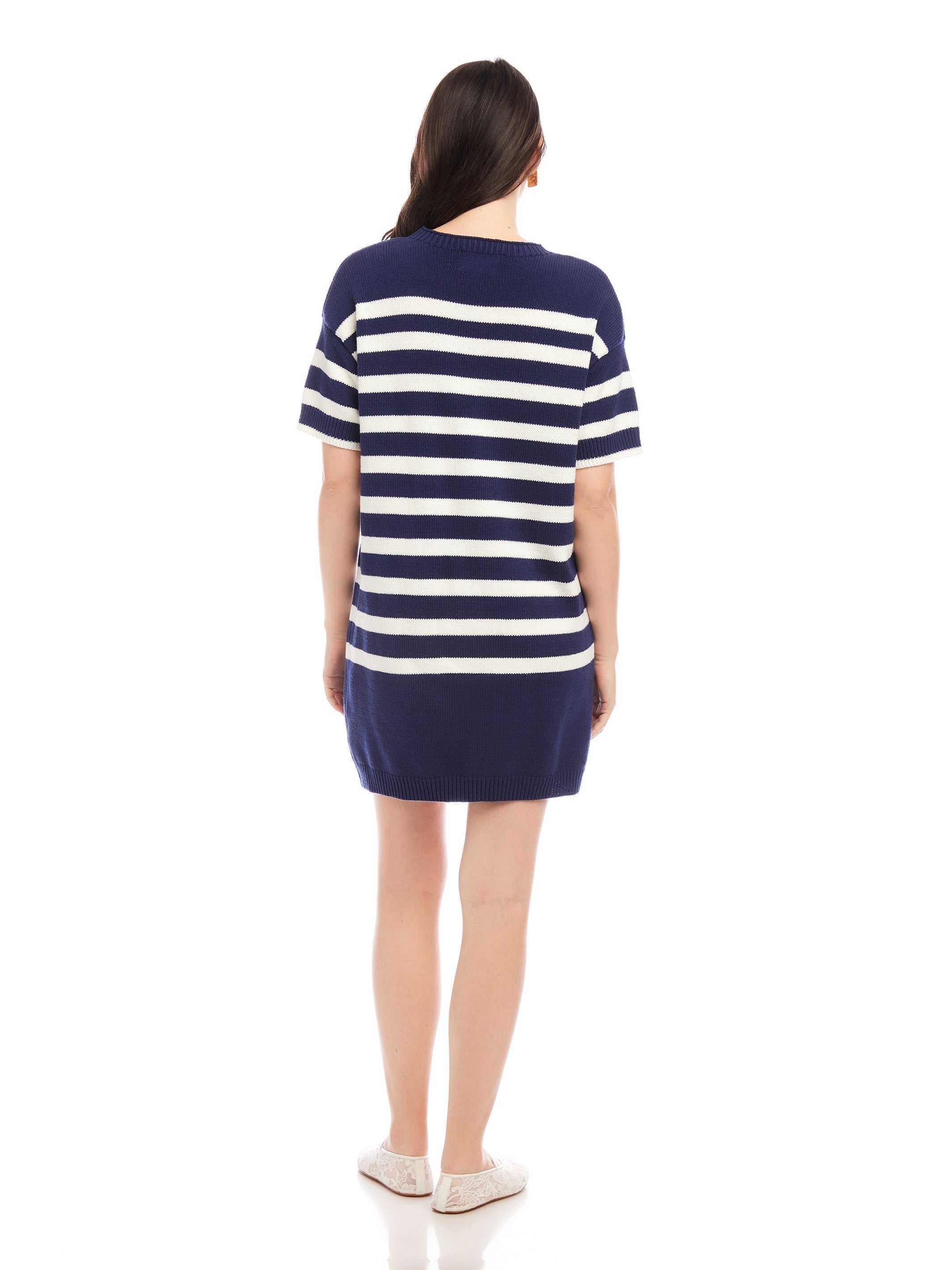 Back view of woman wearing navy and white striped Georgette Sweater Dress with short sleeves and crew neck
