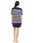 Back view of woman wearing navy and white striped Georgette Sweater Dress with short sleeves and crew neck