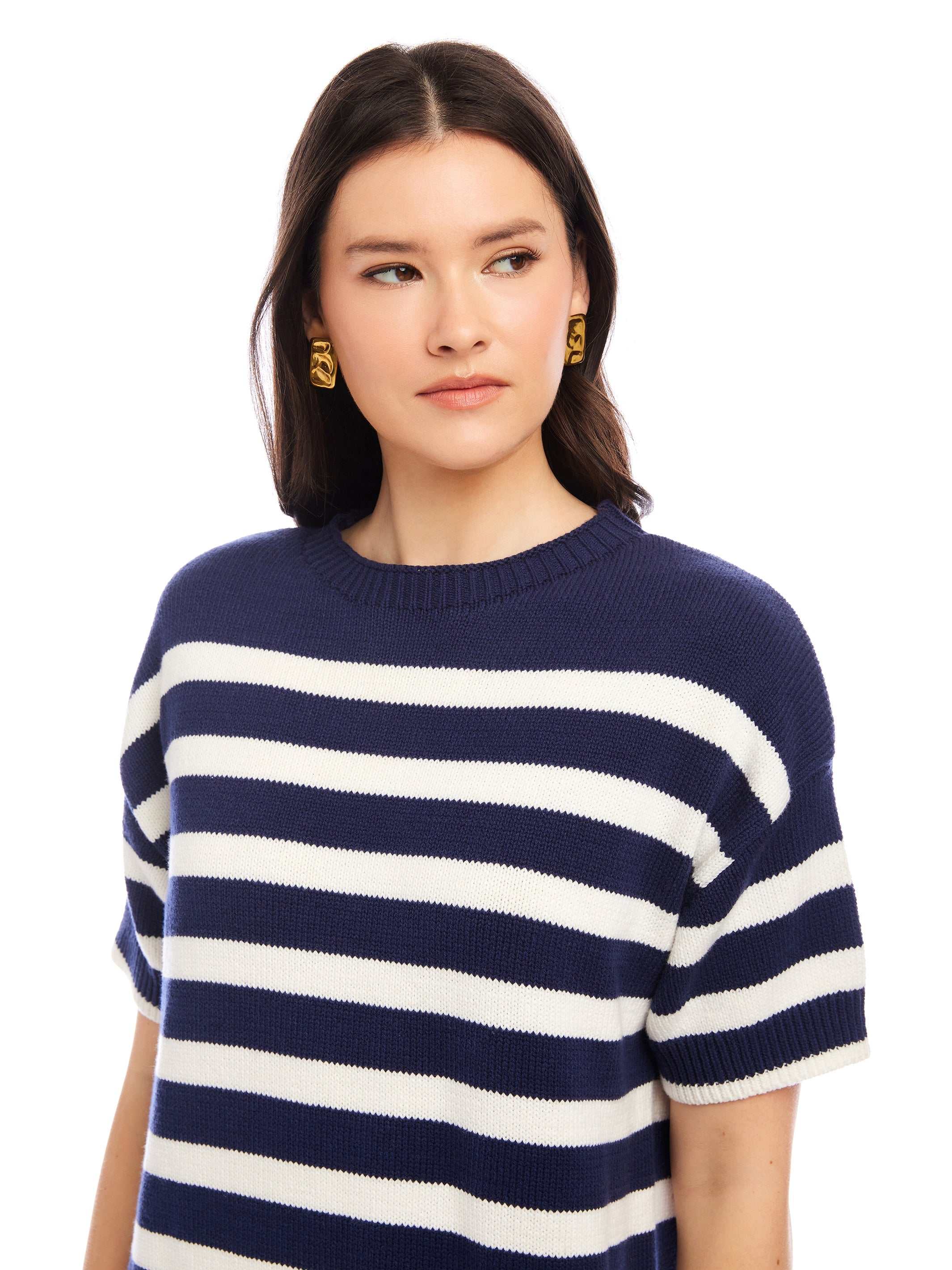 Woman wearing a navy and white striped Georgette Sweater Dress with short sleeves and crew neck