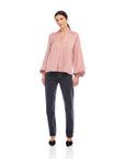 Kiera Blouson Sleeve Top with silky texture, V-neck, long flowy sleeves, and elastic cuffs in relaxed fit style