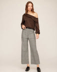Woman wearing high-rise, wide-leg Rylee Crop Pants in stretch plaid fabric with belt loops and front pockets