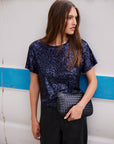 Aerin Sequin Top in navy blue sequin mesh with short sleeves, scoop neck, and relaxed fit