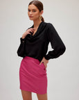 Vegan leather mini skirt with side zipper and flattering silhouette made in USA