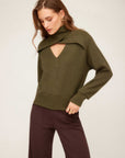 Woman wearing olive green Caly Turtleneck Sweater with built-in scarf detail and deep V-neckline.