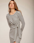 Model wearing Maddie Long Sleeve Midi Dress in off white with black stripes, featuring side-tie knot and high slit