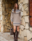 Vera Jacquard Sweater Dress in a tan knit with blue and white geometric jacquard yoke, cuffs, and hem.