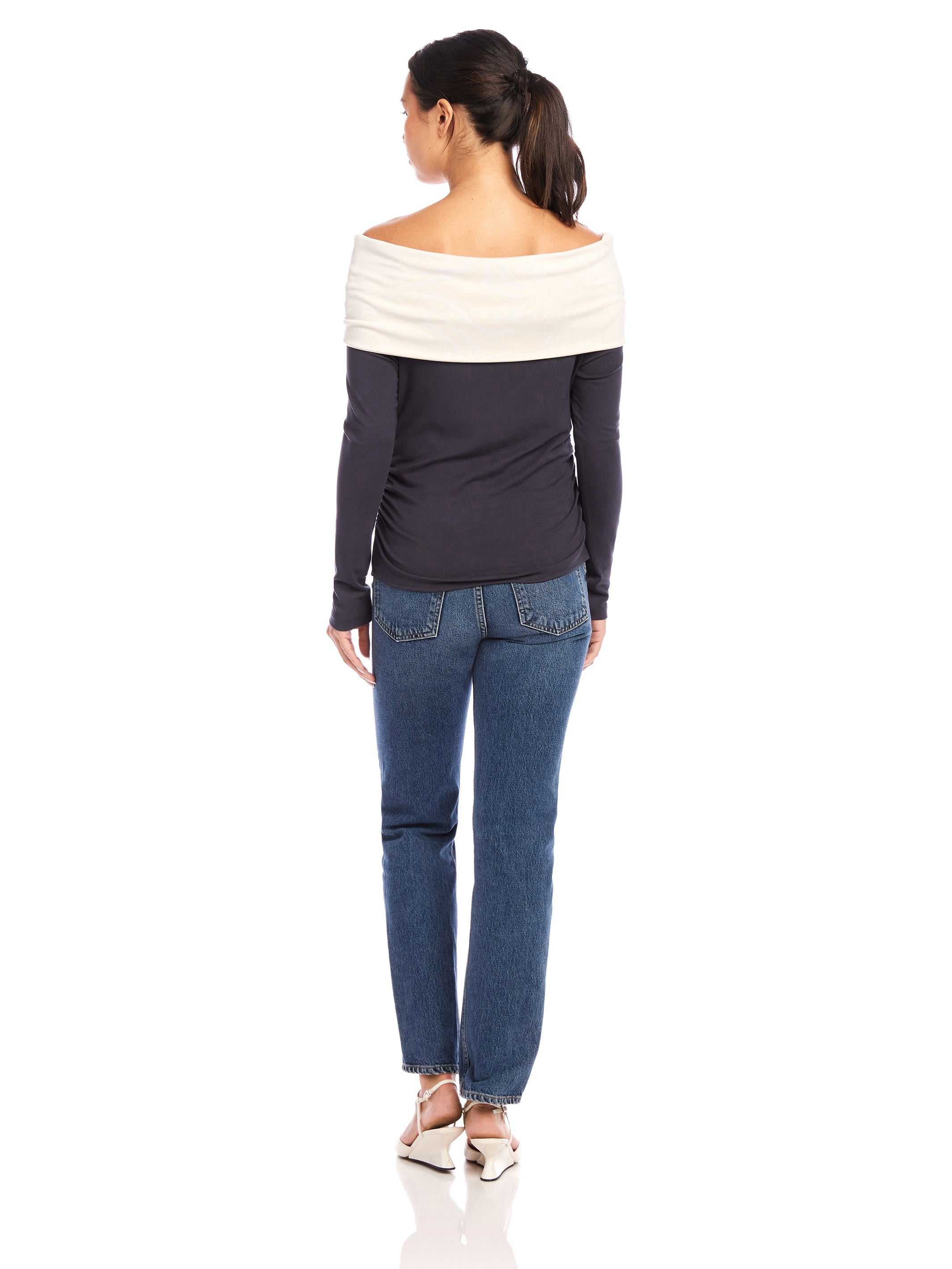 Woman wearing Jillian Off-The-Shoulder Top with twist neck, side shirring, long sleeves, and fitted silhouette from the back