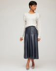 Bronwyn Faux Patent Leather midi skirt in glossy black with paneled seaming and side pockets