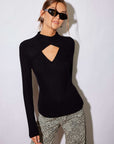 Kari Crossover Top in black ribbed fabric, with long sleeves, a mock neckline and a front diamond-shaped cutout.
