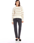 Woman wearing Luca Crewneck Sweater in white with beige stripes and black jeans