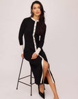 Black Maves Dress with white contrast button-down front, long sleeves, crew neck, and front slit in cozy sweater material