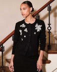 Black Bree Embellished Cardigan with beaded white leaf embroidery, round neck, button front, and long sleeves.