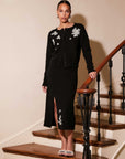 Brett Embellished Sweater Skirt in black with beaded leaf embroidery and front slit, styled with matching cardigan