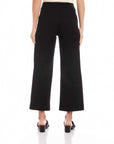 Black wide-leg cropped pants made of double stretch twill with an elastic waistband, shown from the back.
