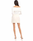 Woman wearing white Maribel Modern Skirt with a pencil silhouette and side pockets, shown from the back
