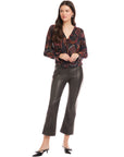 Sleek black Sigourney Pintuck Pants in faux leather with wide-leg, cropped length, elastic waistband, and front pintuck seams.