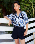 Yvette Blouson Sleeve Top with abstract blue print, collared button-up and relaxed blouson sleeves