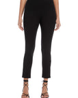 Black ankle slit pants with elastic waistband and slim fit, styled with strappy heels