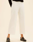 White wide-leg cropped pants made from stretchy viscose blend with elastic waistband and relaxed fit.