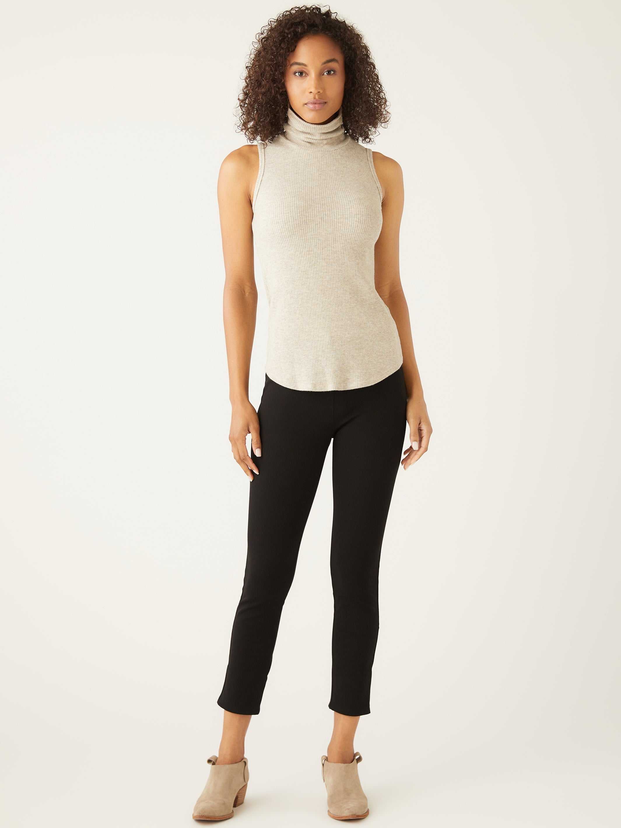 Slim fit sleeveless turtleneck rib-knit top perfect for layering or wearing alone