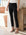 Black ankle slit pant with elastic waistband and slim fit design