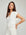 Morgan V-Neck Top in soft white fleece, featuring a split V-neck, contrast trim, and short sleeves
