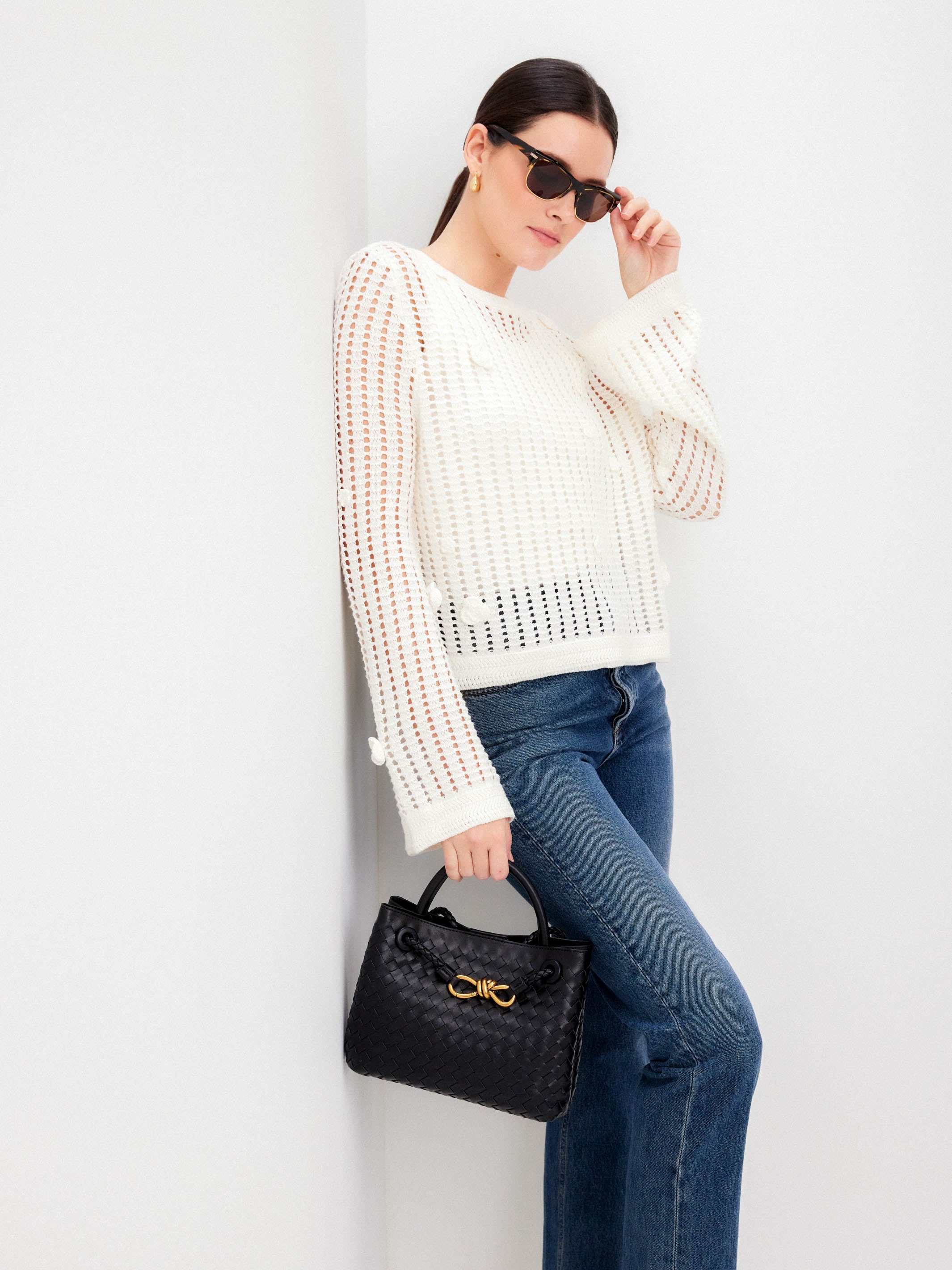 Liv Crochet Sweater with semi-sheer open-weave design, flared sleeves, and back keyhole closure.