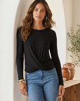 Woman wearing soft bamboo rib knit Long Sleeve Twist Front top with long sleeves and twist front detail