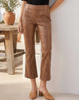 Brown latte Sigourney Pintuck Pants in faux leather with pintuck detailing and flared cropped legs