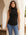 Sleeveless turtleneck top in brushed rib fabric with curved shirttail hem and comfortable stretch