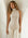 Sleeveless turtleneck top in soft brushed rib fabric with shirttail hem and stretch fit