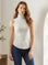 Sleeveless turtleneck top in brushed rib fabric with shirttail hem and comfortable stretch