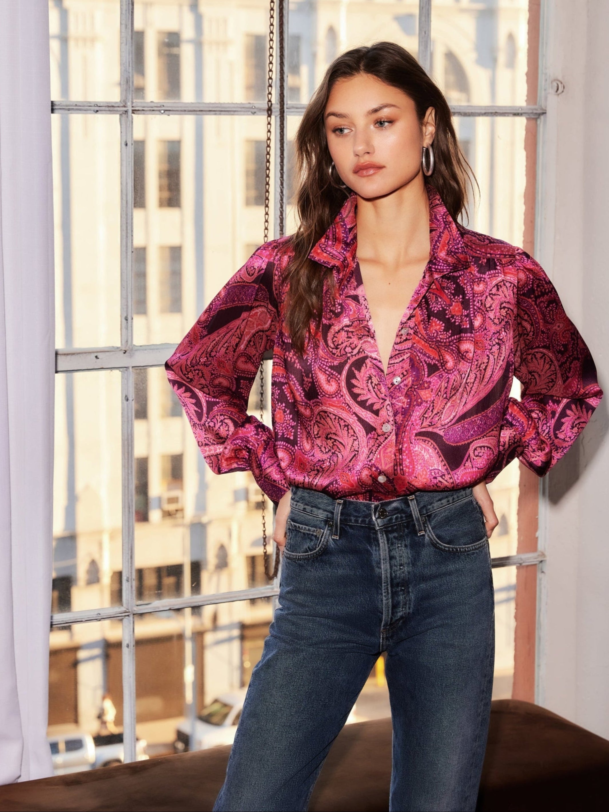 Woman wearing a paisley crinkle satin Chloe Blouse with gathered shoulders and button-down front in a relaxed fit