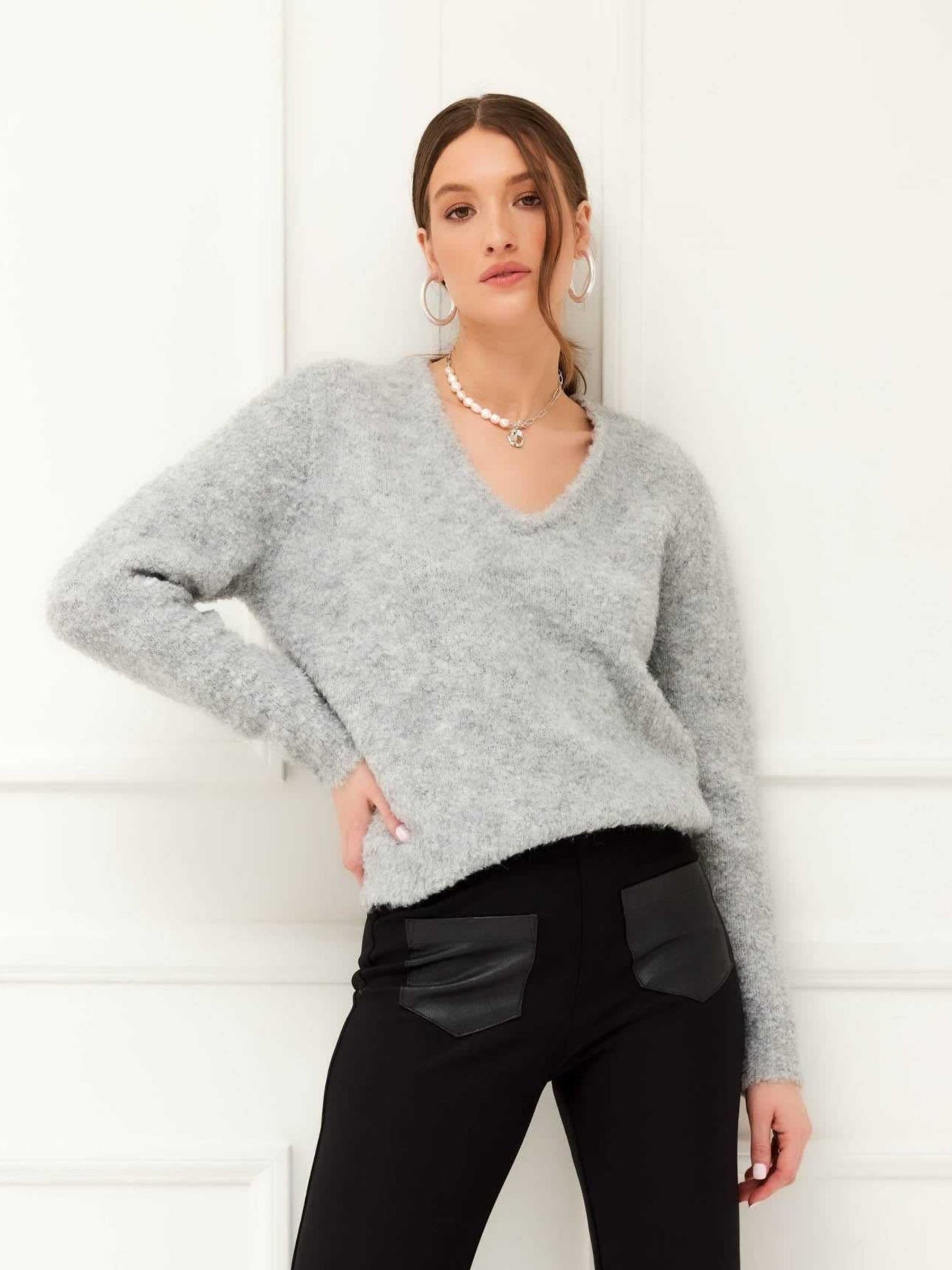 Cozy V-neck sweater with relaxed long sleeves made from a recycled polyester blend