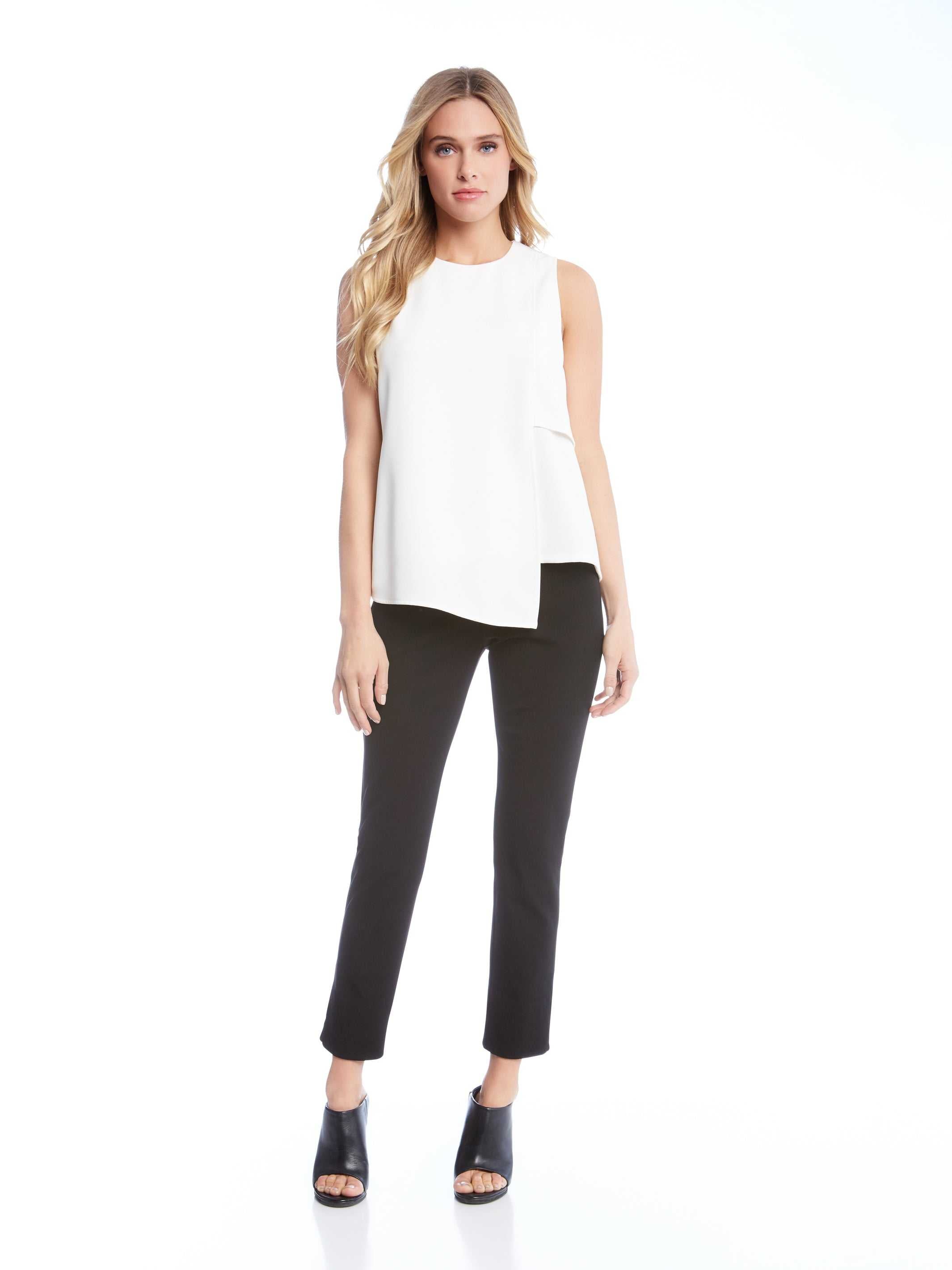 Woman wearing black ankle slit pant with white sleeveless top and black open-toe heels
